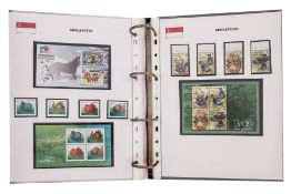 TWO COMPREHENSIVE ALBUMS OF SINGAPORE MINT STAMP SETS, 1949-2004