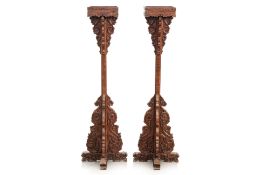 A PAIR OF CHINESE CARVED WOOD LANTERN OR CANDLE STANDS
