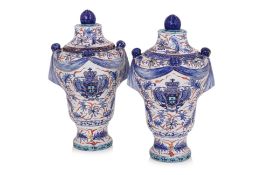 A PAIR OF IMARI ARMORIAL STLYE PORCELAIN VASES AND COVERS