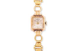 A LADY'S ENICAR GOLD COCKTAIL WATCH