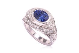 A SAPPHIRE AND DIAMOND RING