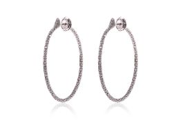 A PAIR OF LARGE DIAMOND HOOP EARRINGS BY ROBERTO DEMEGLIO