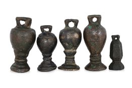 A GROUP OF FIVE BRASS WEIGHTS