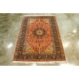 A LARGE MEDALLION WOOL RUG (290 x 190cm)