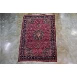 A VERY LARGE MASHAD WOOL CARPET (495 x 355cm)