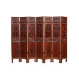 A SEVEN PANEL WOODEN SCREEN