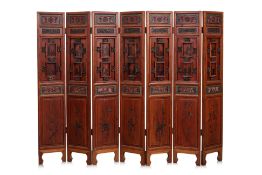 A SEVEN PANEL WOODEN SCREEN