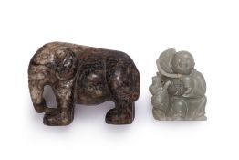 A JADE MODEL OF AN ELEPHANT AND STANDING FIGURE