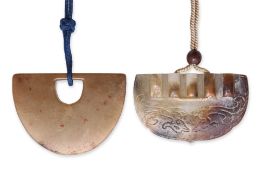 TWO CARVED JADE PENDANTS