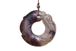 AN ARCHAISTIC JADE DRAGON 'BI' DISC