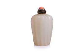 A PALE-CELADON JADE SNUFF BOTTLE