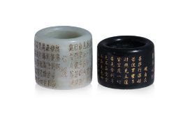TWO JADE THUMB RINGS WITH INSCRIBED HEART SUTRA