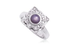 A PURPLE STAR SAPPHIRE AND DIAMOND RING