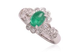 AN EMERALD AND DIAMOND RING