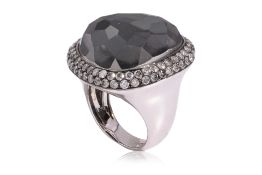 A LARGE TOPAZ DOUBLET AND DIAMOND RING
