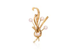 AN AKOYA CULTURED PEARL AND TEXTURED GOLD SPRAY BROOCH