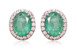 A PAIR OF EMERALD AND WHITE SAPPHIRE 'HALO' EARRINGS
