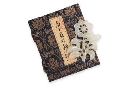A WHITE JADE FLORAL CARVING