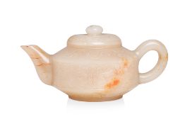 A CARVED JADE TEAPOT AND COVER