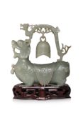 A CELADON JADE MODEL OF A PIXIU