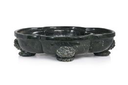 A VERY LARGE AND IMPRESSIVE SPINACH JADE WASHER