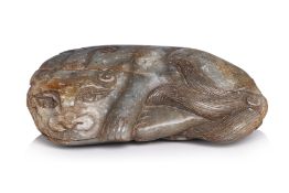 A JADE BOULDER CARVING OF A FELINE MYTHICAL CREATURE