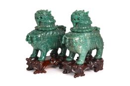 A PAIR OF GREEN JADE BUDDHIST LION VESSELS