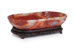 A LARGE BASKETWEAVE CARVED AGATE WASHER