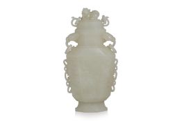 A FINELY CARVED ARCHAISTIC WHITE JADE VASE AND COVER