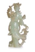 A SERPENTINE JADE FIGURE OF A LADY