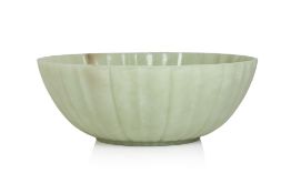 A LARGE MUGHAL STLYE FLUTED AND BARBED GREEN JADE BOWL