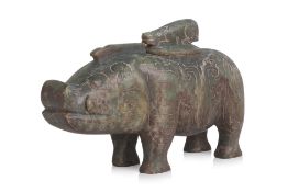 AN ARCHAISTIC GREEN JADE BOAR VESSEL