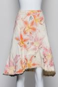 ROBERTO CAVALLI - A FLORAL LEATHER SKIRT WITH A LEOPARD PRINT TRIM