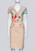 JOHN GALLIANO - A FLORAL SHIRT AND BEIGE SKIRT ENSEMBLE