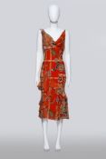 JOHN GALLIANO - AN ORANGE SILK FLORAL DRESS