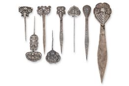 A GROUP OF EIGHT SILVER HAIRPINS