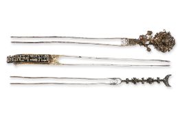 A GROUP OF THREE LARGE SILVER-GILT HAIRPINS