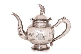 A SMALL SILVER TEAPOT