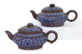 A PAIR OF ENAMELLED YIXING POTTERY TEAPOTS