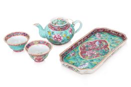 A FAMILLE ROSE TURQUOISE GROUND TRAY, TEAPOT AND PAIR OF TEA BOWLS