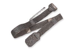 A HEAVY SILVER BELT AND TRI-FORM BUCKLE