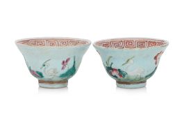 A PAIR OF BLUE GROUND FAMILLE ROSE TEA BOWLS