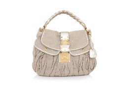 MIU MIU – A BEIGE LINEN AND GOLD LEATHER ‘MALTESE COFFER’ HANDBAG
