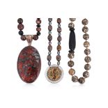 A GROUP OF THREE NECKLACES
