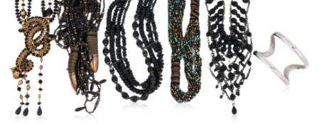 A GROUP OF FIVE COSTUME NECKLACES AND A SILVER TONED BANGLE