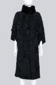 LEVINSON - A LONG BLACK LAMBSWOOL COAT WITH A FUR COLLAR