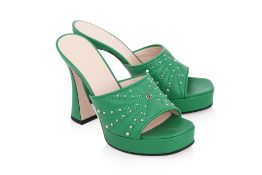 GUCCI - A PAIR OF GREEN STUDDED AND QUILTED HEELS
