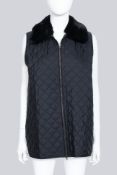 JIL SANDER NAVY - A SLEEVELESS BLACK QUILTED JACKET WITH A FUR NECKLINE