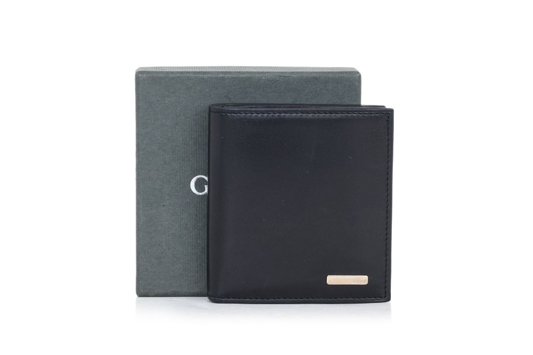 GUCCI - A LEATHER WALLET - Image 1 of 4