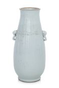 A LARGE WHITE-GLAZED TWIN HANDLED PORCELAIN VASE
